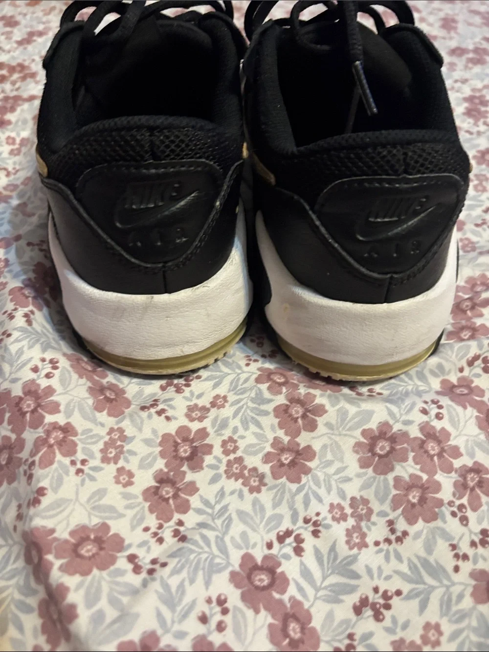 Nike Women's Black Sneakers with Subtle Gold Accent